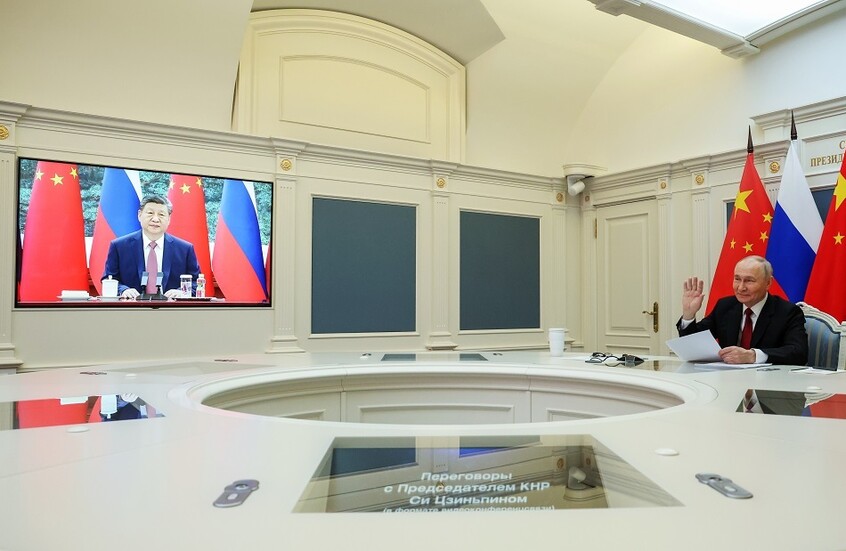 أوشاكوف: شي دعا بوتين لزيارة الصين